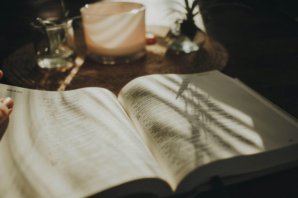a person is reading a book on a table